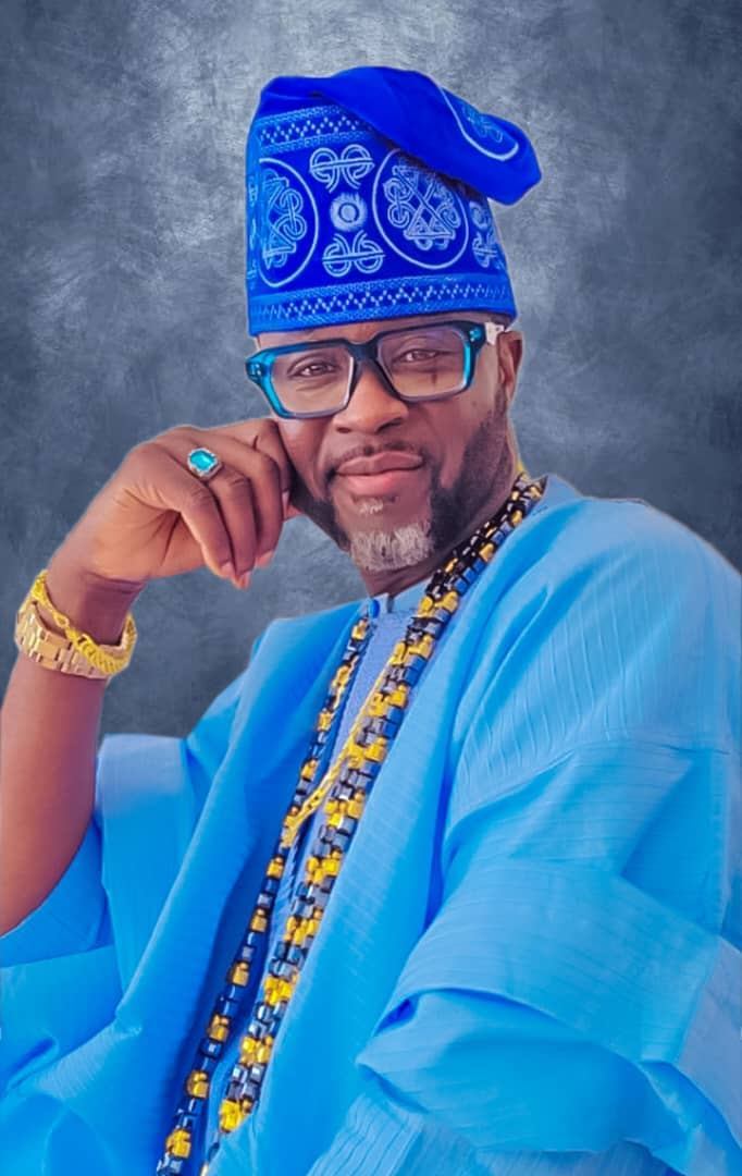Adekunle Moshood in light blue Agbada, relaxed