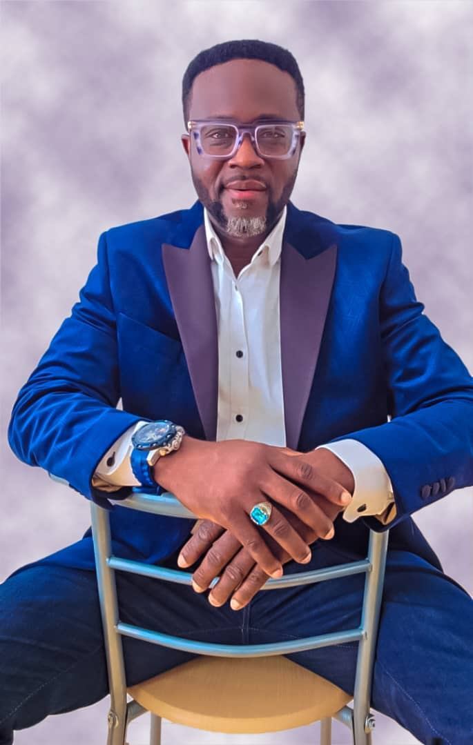 Adekunle Moshood in bespoke navy tuxedo blazer