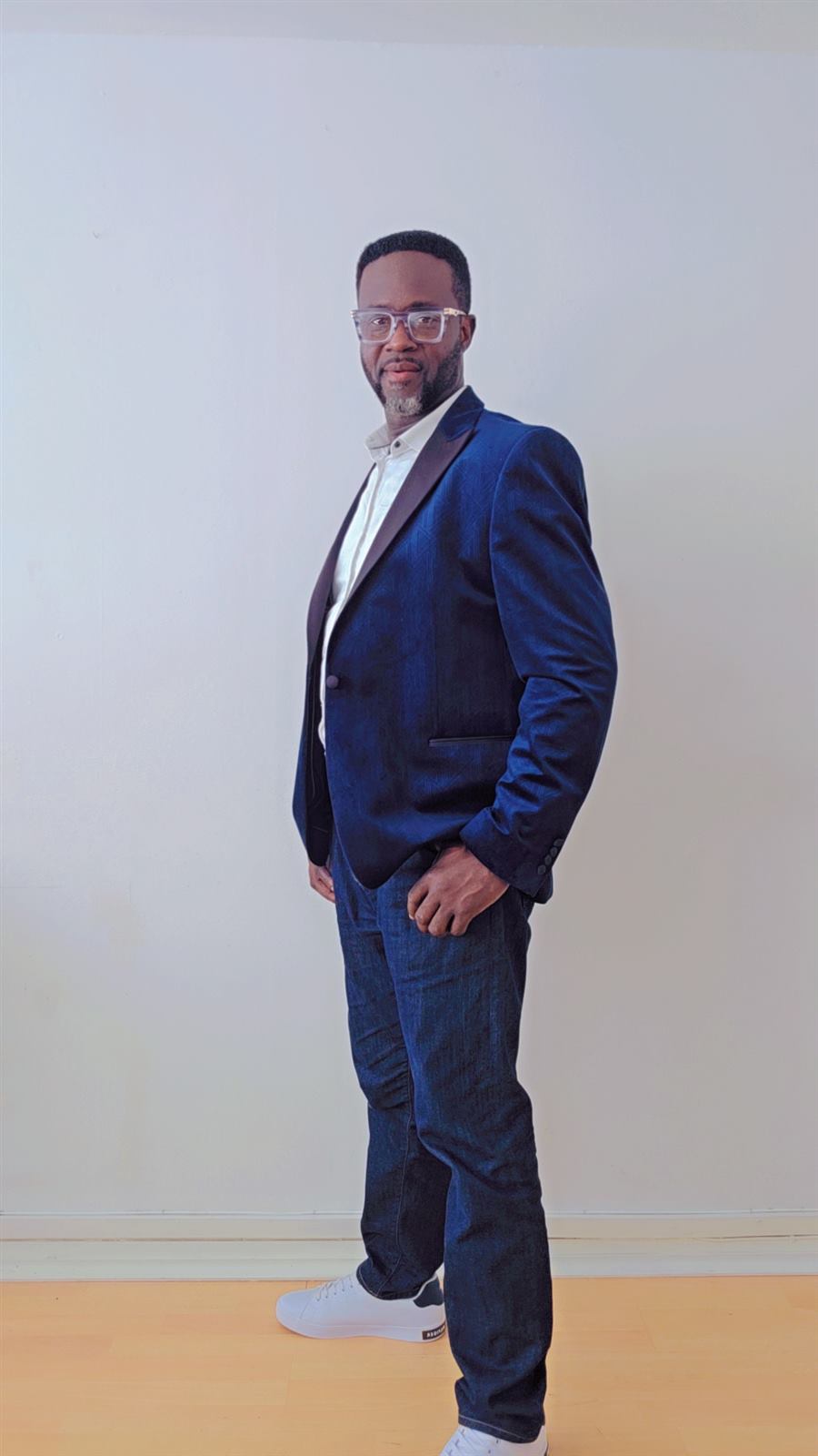 Adekunle Moshood full-length bespoke navy blazer side pose