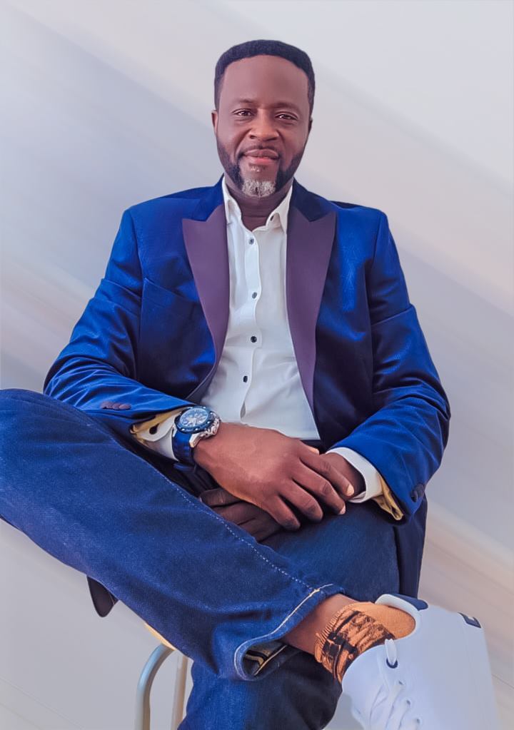 Adekunle Moshood seated in editorial portrait